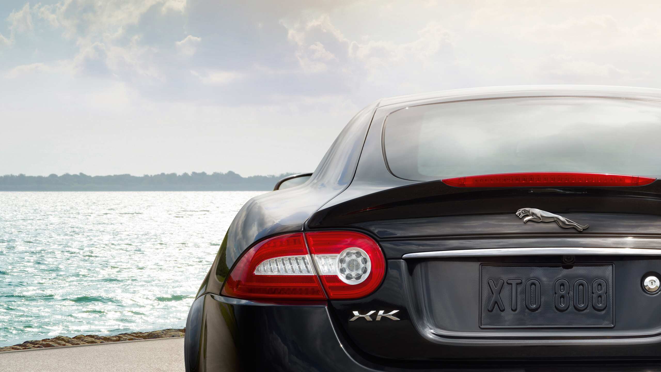 Jaguar XK parked at Infront of beach 