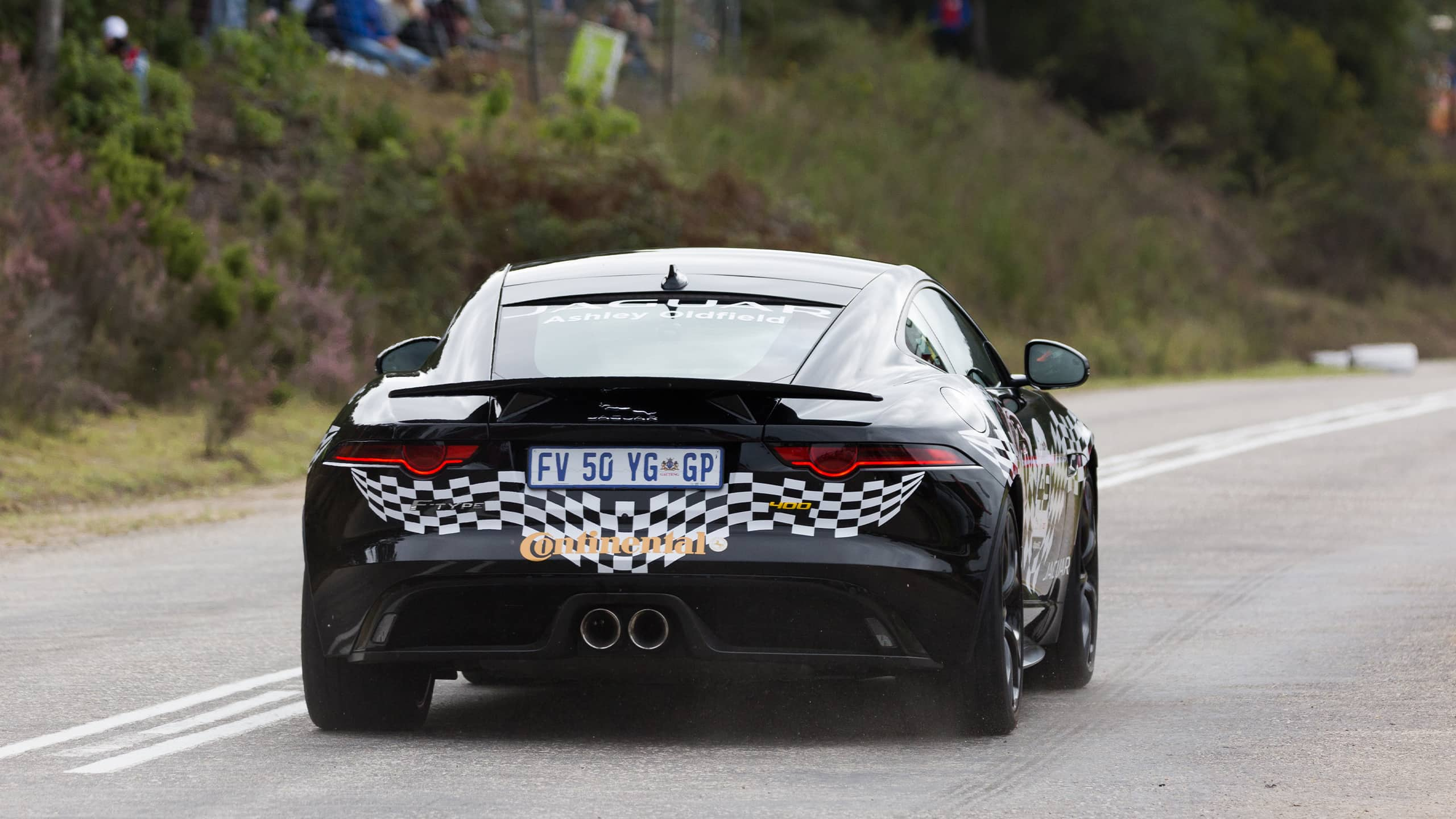 Jaguar F-Type running on racing track